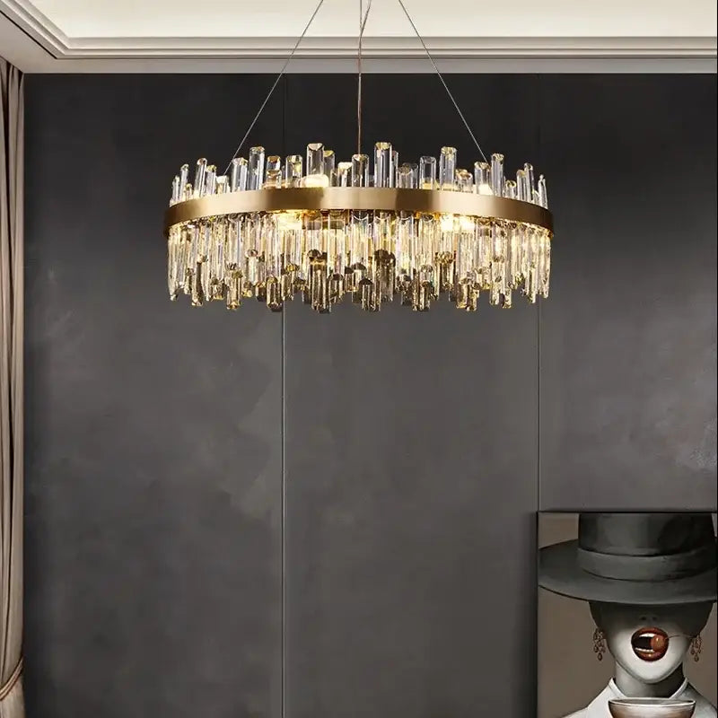 A luxurious gold crystal led chandelier with circular metal frame and clear prisms for living and dining room