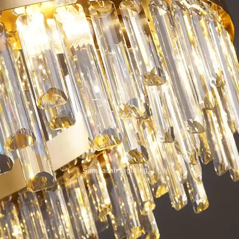 Luxurious gold crystal led chandelier with cascading clear crystal prisms and faceted accents for living room use