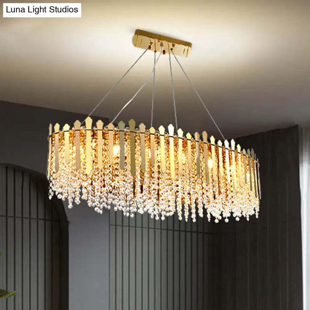 DecorBites 14-light gold elliptical island pendant light fixture with vertical gold-toned prisms and clear crystal beads