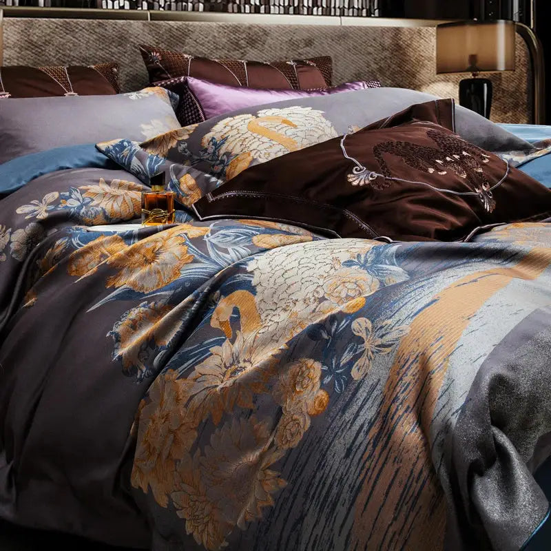 Luxurious dark blue satin duvet cover with gold floral embroidery and matching pillows in a 1500tc egyptian cotton jacquard bedding set
