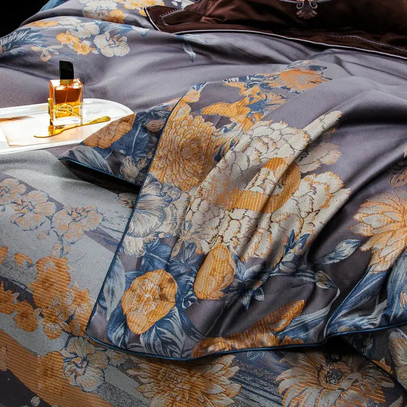 Luxurious dark gray satin duvet cover with intricate gold and blue floral embroidery from decorbites jacquard egyptian cotton bedding set