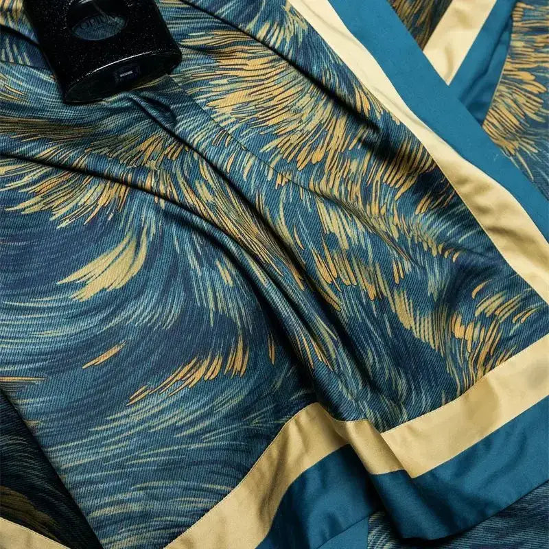 Luxurious teal and gold feather-patterned silk scarf with cream satin trim complements decorbites blue starry sky bedding set
