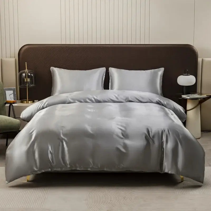 Silver satin duvet cover and pillowcase set with smooth glossy finish and elegant drape by decorbites ice rayon