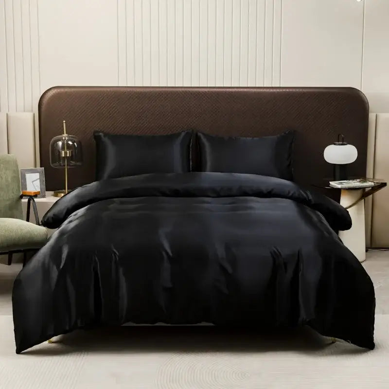 Luxurious black satin duvet cover and pillowcase set with smooth glossy finish by decorbites ice rayon for elegant bedding decor