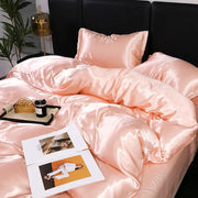 Luxurious peach satin duvet cover and pillowcase set with a smooth glossy finish made from decorbites ice rayon