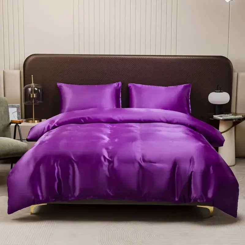Vibrant purple satin duvet cover and pillowcase set with glossy finish and elegant draping by decorbites ice rayon