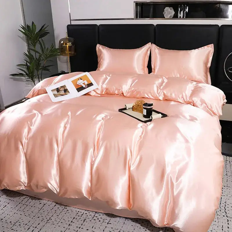 Luxurious peach satin duvet cover and pillowcase set in blush pink with smooth glossy finish and elegant folds decorbites ice rayon