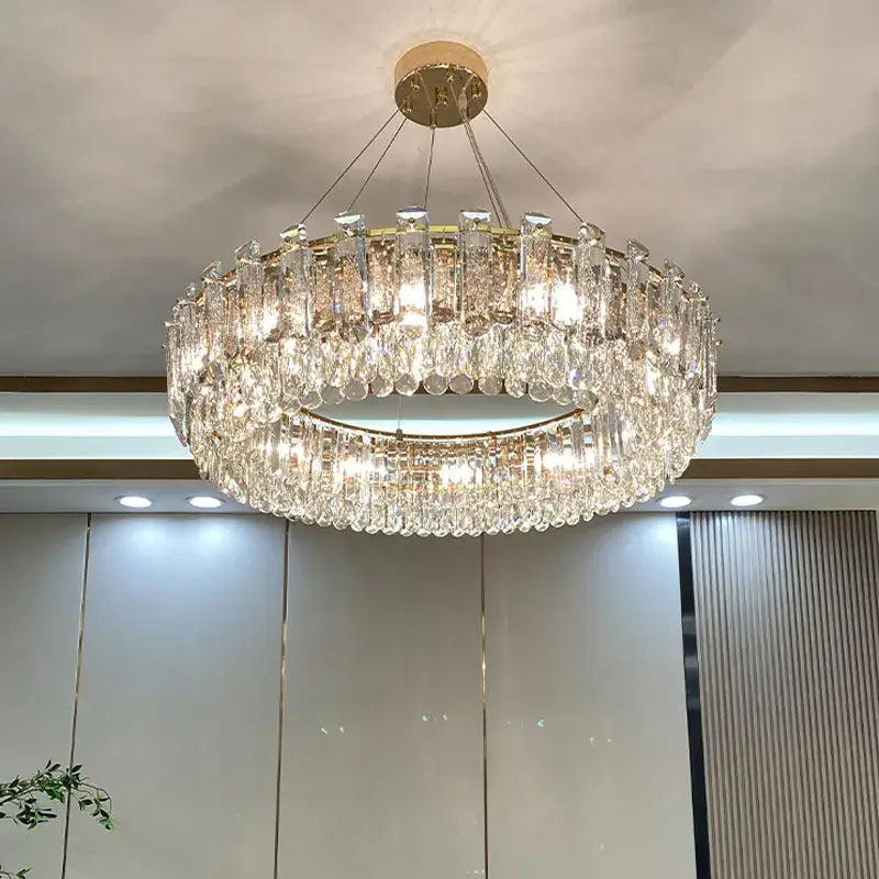 Luxurious two tier gold crystal chandelier with cylindrical glass elements for dining room decorbites gold round oval