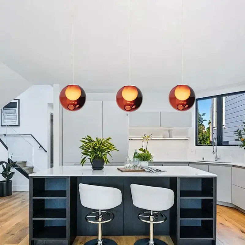 Three amber glass pendant lights hang above a kitchen island luxury amber glass sphere pendant light dimmable led decorbites clear glass