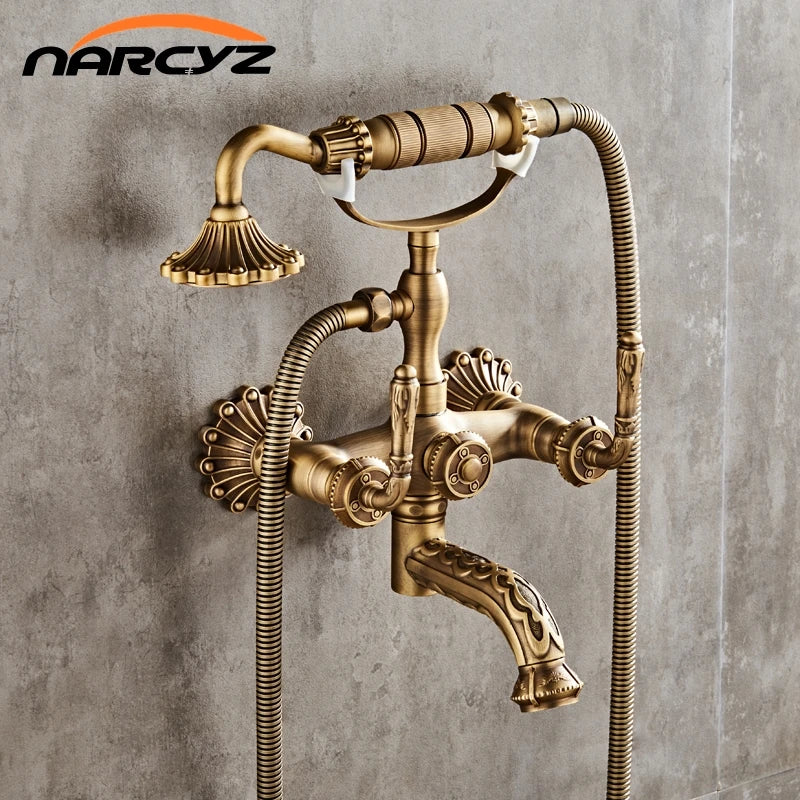 Luxury antique brass wall mounted shower faucet set with vintage style fluted detailing and two flexible hoses