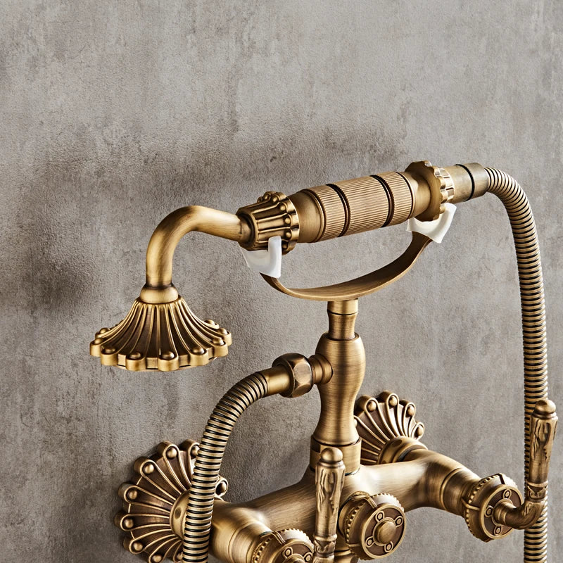 Luxury antique brass wall mounted shower faucet with ornate fluted spouts and decorative handles for bathroom use