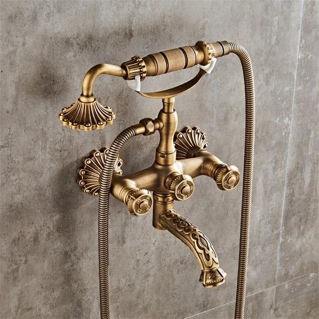 Luxury antique brass wall mounted shower faucet set with ornate shell handles and decorative spout mixer tap