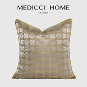 Luxury beige satin pillow cover with intricate gold quatrefoil geometric embroidery and matching gold trim for decorbites decor