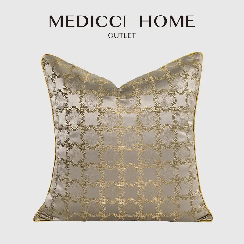 Luxury beige satin pillow cover with intricate gold quatrefoil geometric embroidery and matching gold trim for decorbites decor