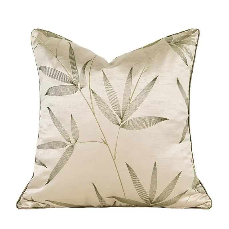 Beige satin pillow cover with subtle gray bamboo leaf embroidery for decorbites gold quatrefoil geometric decor