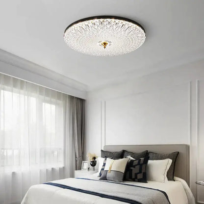 Luxury black and gold glass round ceiling lamp with intricate crystal design and central gold-toned fixture for bedroom