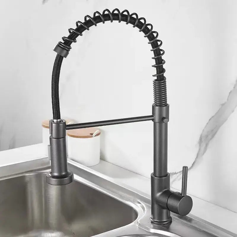 Luxury black and gold kitchen faucet with pull out spring hose featuring a black matte finish and flexible gooseneck spout