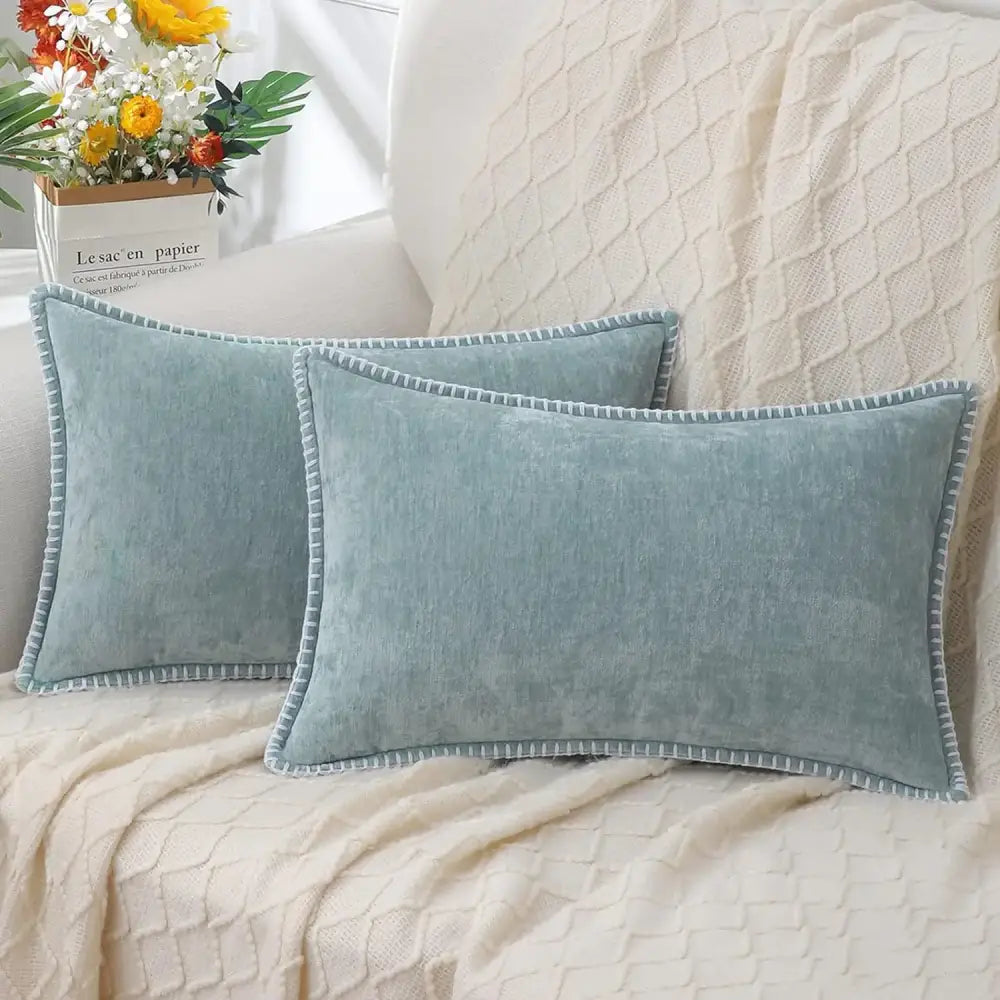 Two light blue chenille cushion covers with stitched edge and subtle texture for luxury decorbites living room decor
