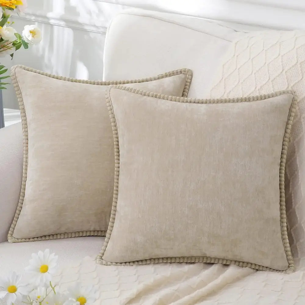 Beige square throw pillows with textured fabric and pom-pom trim complement luxury blue chenille cushion covers decorbites blue chenille cushion