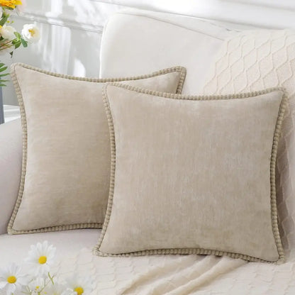 Beige square throw pillows with textured fabric and pom-pom trim complement luxury blue chenille cushion covers decorbites blue chenille cushion