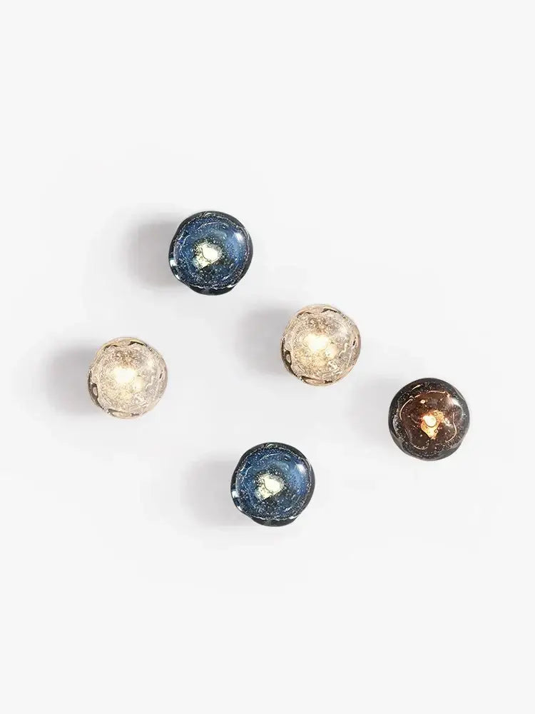 Five spherical glass candle holders with crackled metallic finishes in blue gold and bronze for luxury wall lamp decorbites blue crystal