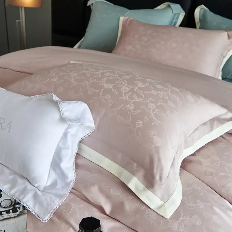 Luxury blush pink satin pillowcase with floral embroidery and white border in duvet cover set bedroom bedding
