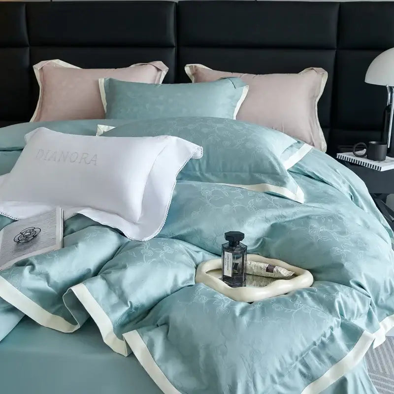 Luxury blush pink floral jacquard duvet cover set with soft teal satin cover set featuring white piping and matching pillowcases