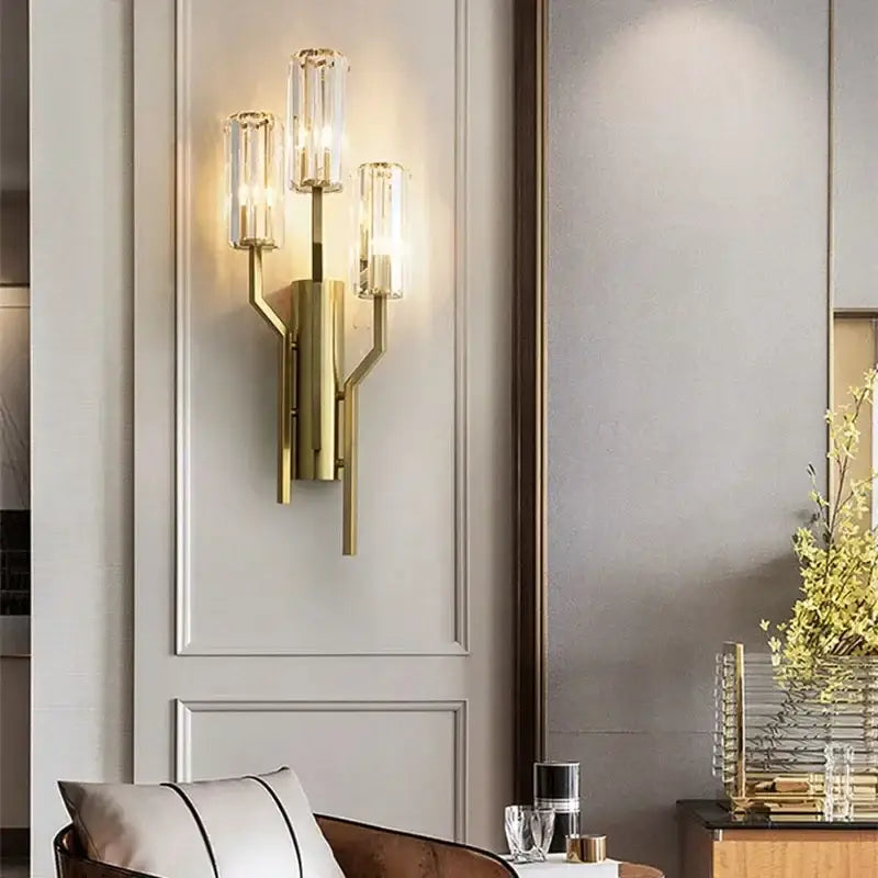 Luxury brass crystal wall lamp with gold-toned branching design and ribbed glass cylinders for bedroom decorbites wall lamp