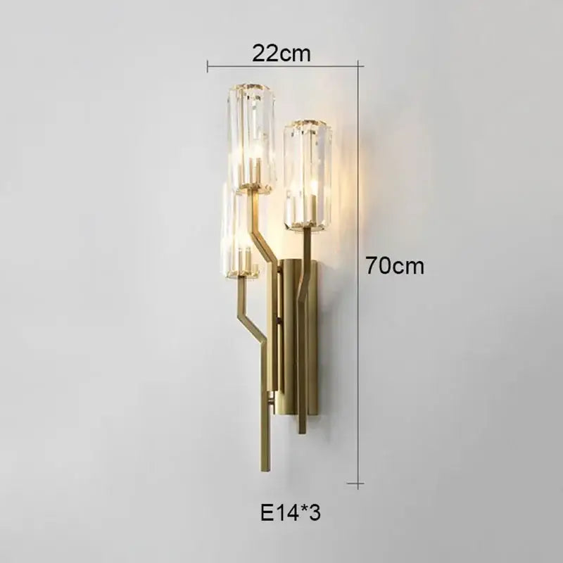 Luxury brass crystal wall lamp with gold-toned branching metal frame and ribbed glass cylinders for bedroom decorbites wall lamp