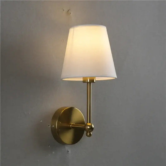 Luxury brass and gold wall lamp bedroom sconce with brass finish and tapered white fabric shade from decorbites led black collection