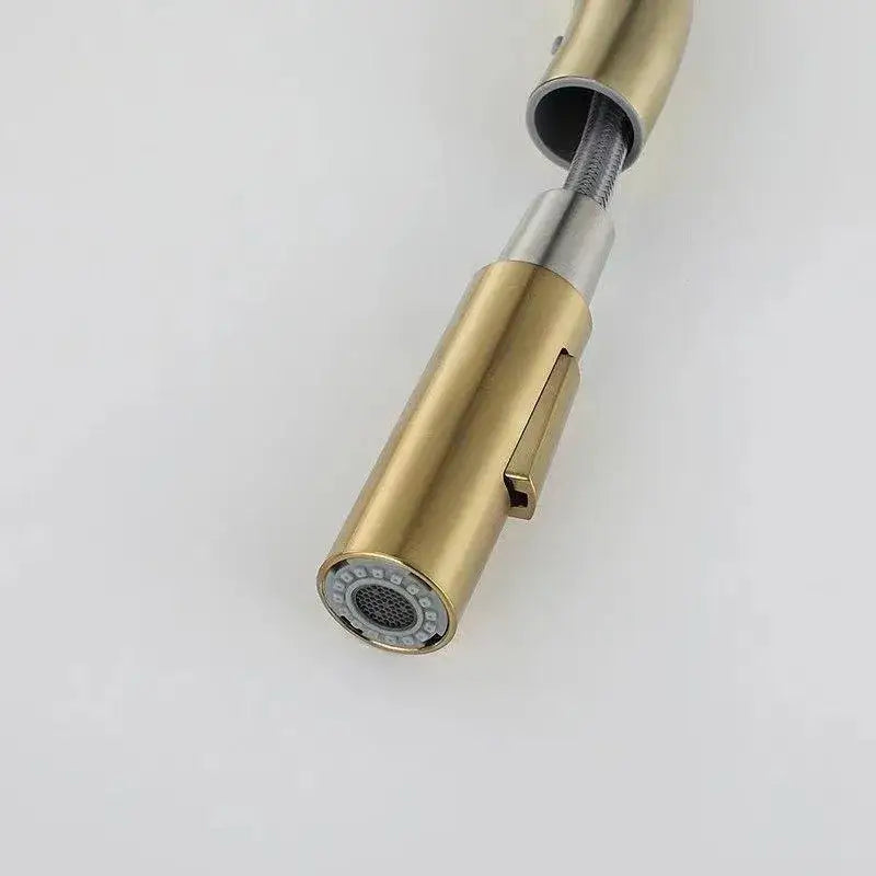 Luxury brushed gold pull out kitchen faucet with antique brass finish, sleek cylindrical design, and stainless steel accents by decorbites