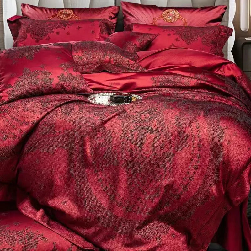 Luxury burgundy red egyptian cotton bedding set with rich satin fabric, floral jacquard embroidery, and gold accents on pillows