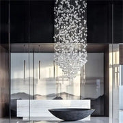 Luxury cascading crystal led chandelier with clear faceted glass pieces suspended on thin metallic wires decorbites crystal led