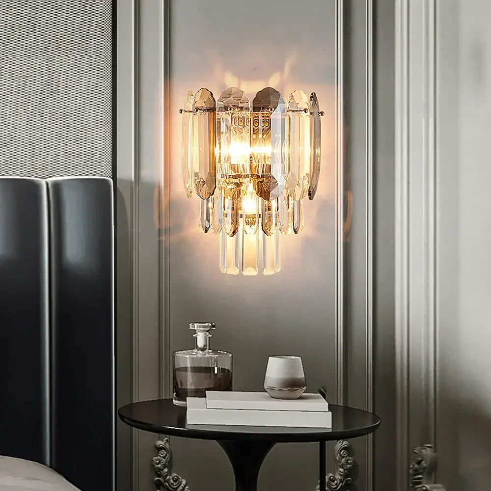 Gold-toned cascading crystal led wall lamp with faceted glass pieces for luxury living room decorbites crystal led lighting
