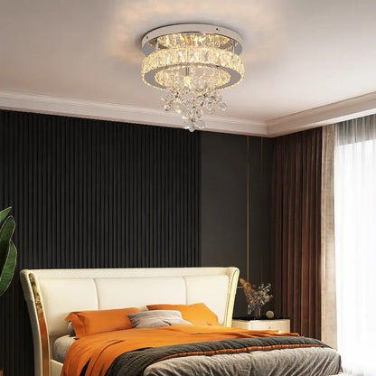 Luxury chrome crystal led ceiling chandelier with faceted glass tiers emitting warm light for living room decorbites crystal led