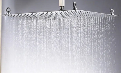 A luxury chrome square shower head with a sleek rectangular ultrathin stainless steel design and multiple water jets