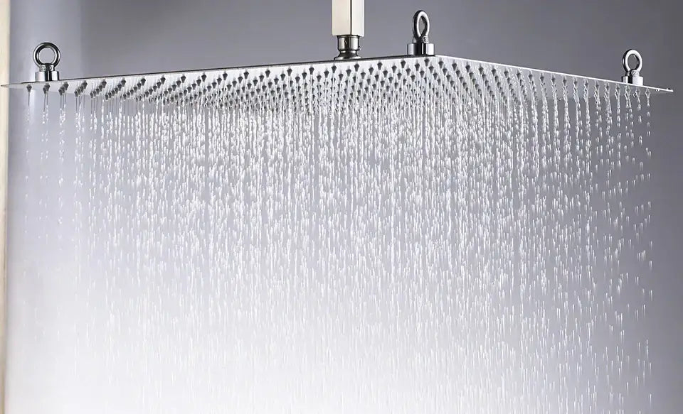 A luxury chrome square shower head with a sleek rectangular ultrathin stainless steel design and multiple water jets
