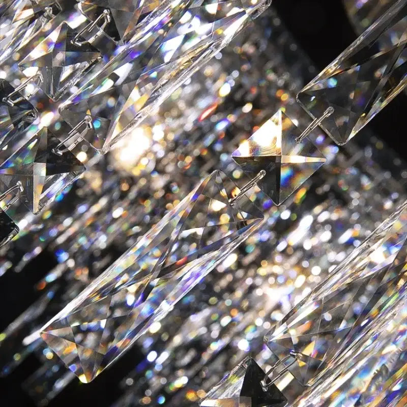 Clear faceted crystal star pendants with iridescent reflections on luxury clear and purple decorbites chrome chandelier