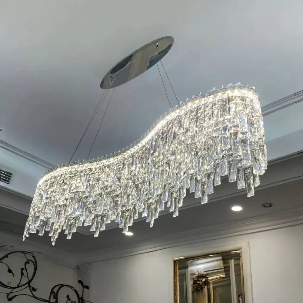 A sleek Luxury clear and purple crystal decorbites chrome chandelier with curved design for dining room light decor