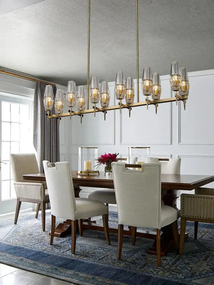 A luxury decorbites copper and glass chandelier with clear shades and warm bulbs for dining room lighting fixture