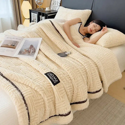 Luxury coral fleece cream-colored textured fleece blanket with dark brown trim ideal for winter bedroom use