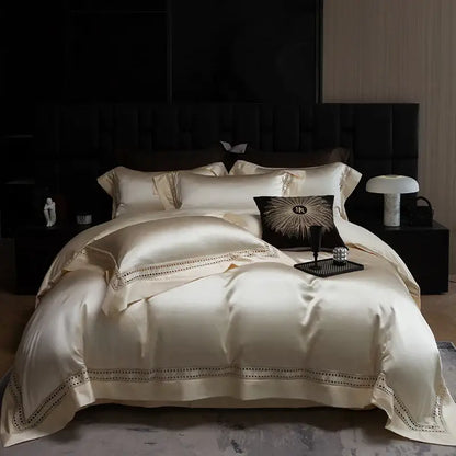 Cream-colored satin bedding set with elegant gold embroidery trim made from decorbites 1000tc egyptian cotton