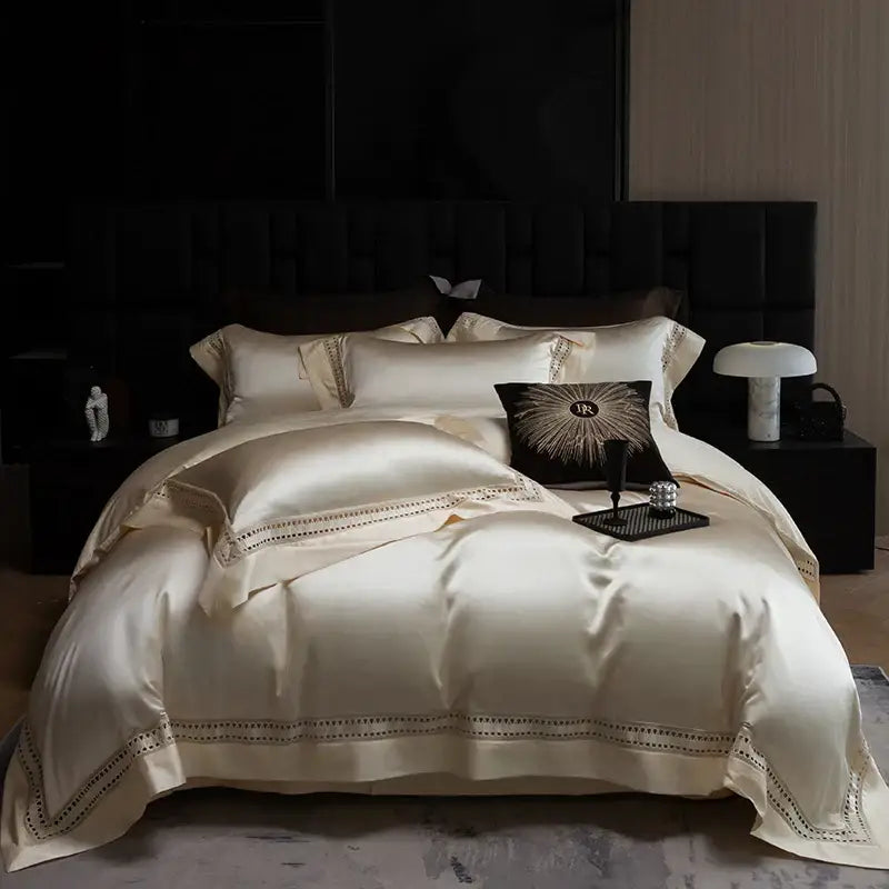 Cream-colored satin bedding set with elegant gold embroidery trim made from decorbites 1000tc egyptian cotton