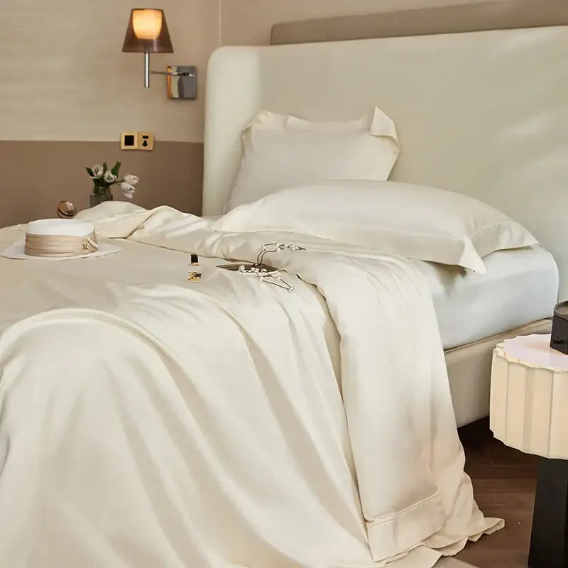 Luxury cream bedding set with cream-colored satin duvet cover featuring silver deer embroidery in decorbites 1400tc pima cotton