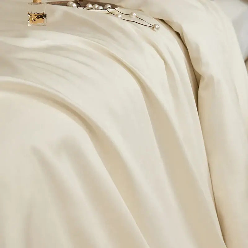Luxury cream satin duvet cover with smooth texture and subtle sheen from decorbites 1400tc pima cotton bedding set