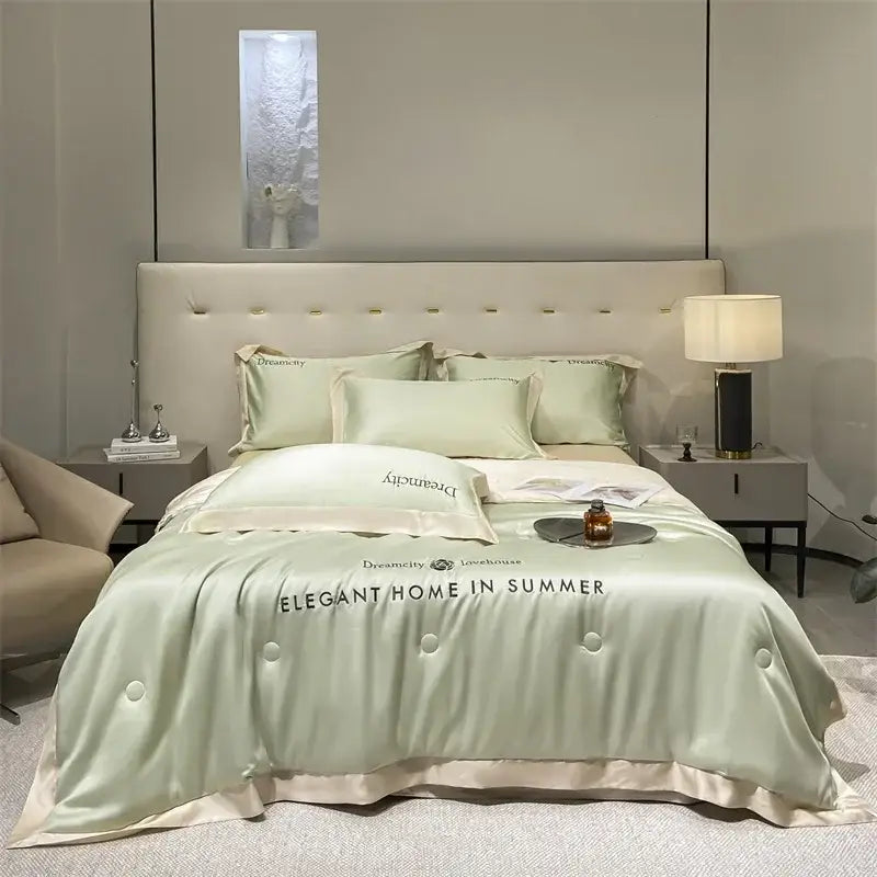 Luxury cream and black ice silk embroidered quilt set with light green satin duvet cover featuring cream piping and buttons