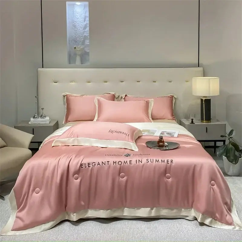 Luxury cream and black ice silk embroidered quilt set with pink satin duvet cover featuring cream piping and button detailing