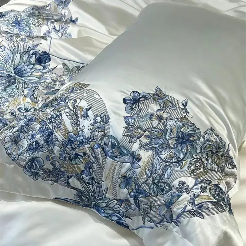 Luxury cream satin pillowcase with intricate blue decorbites butterfly flowers embroidery in a bedding set