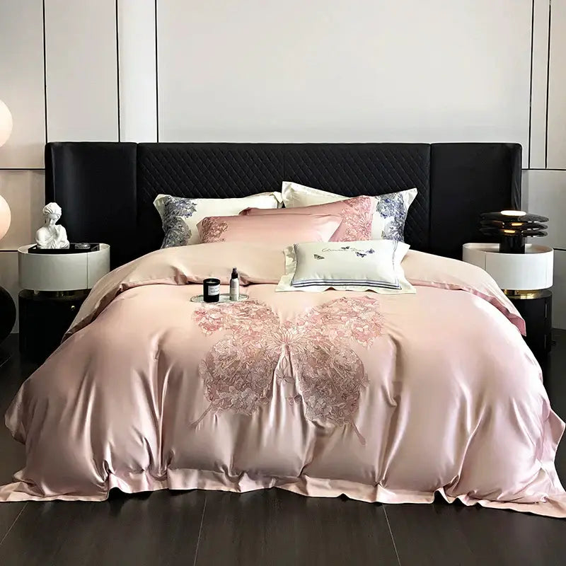Luxurious blush pink satin duvet cover with intricate butterfly flowers embroidery in decorbites bedding set