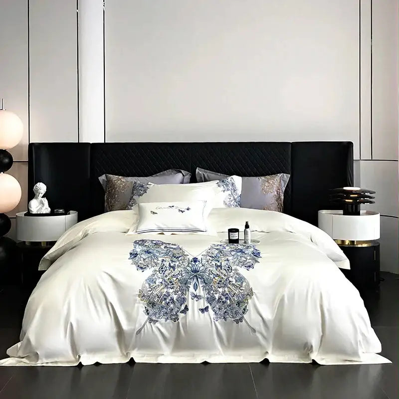 White satin bedding set with intricate blue and silver decorbites butterfly flowers embroidery for luxury bedroom decor